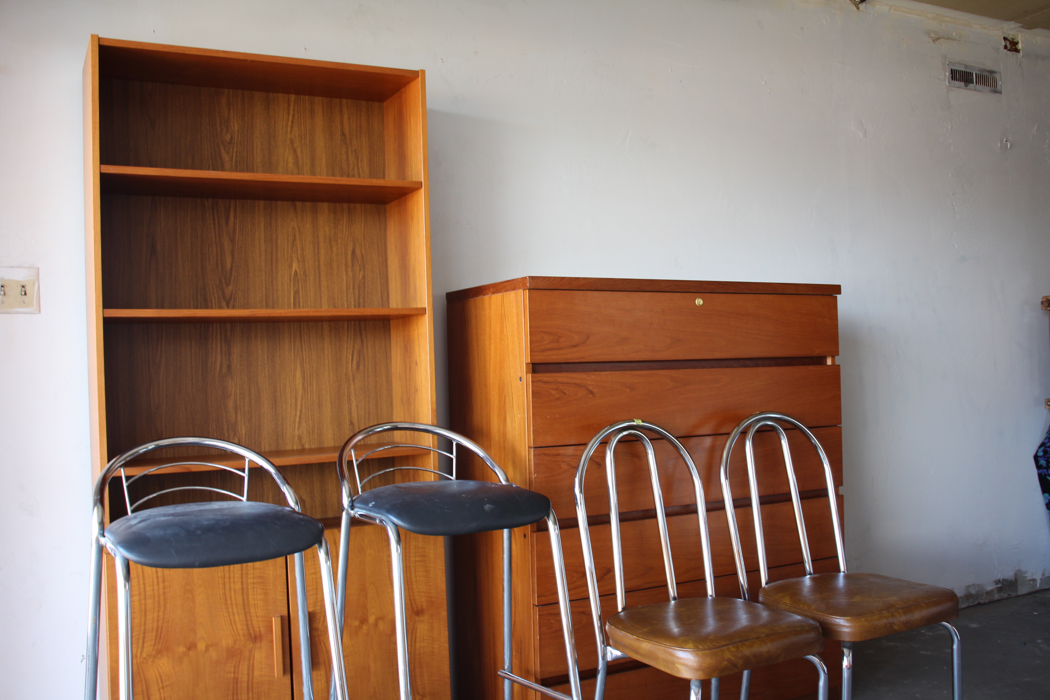 Chrome bar stools and vintage chairs